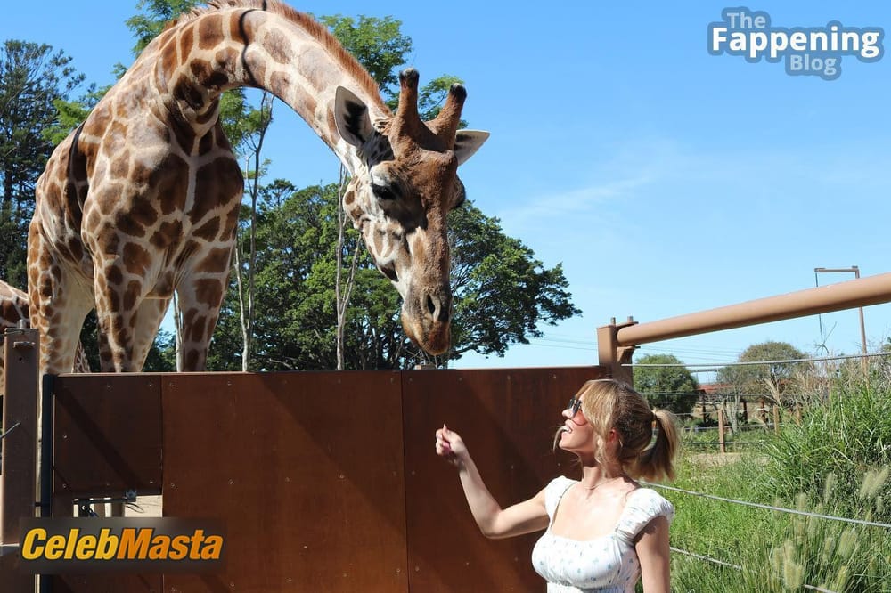 Sydney Sweeney Sexy Seen Examining Giraffes Long Tongue Photo Gallery photo 1