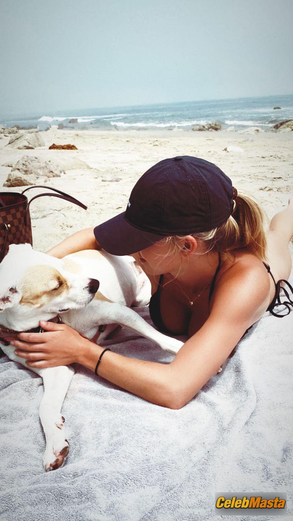 Sydney Sweeney flaunts her sexy body, big butt and boobs while enjoying a day with her dog on the beach Photo Gallery photo 1