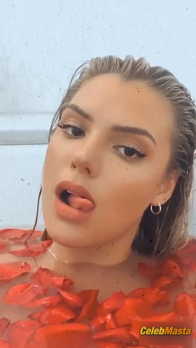 Alissa Violet in the bath with rose petals covering her breasts with her hands Photo Gallery photo 1