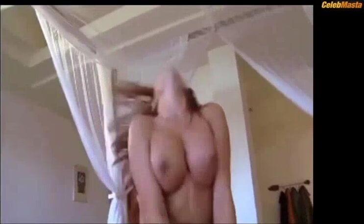 Erika Jordan's Tits Scene from Sexy Wives Sindrome