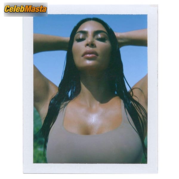 Kim Kardashian soaks up the sun on the beach while flashing her curves in new Skims photo 5
