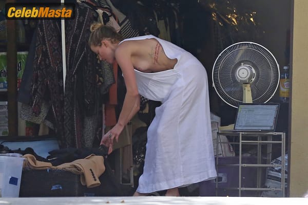 Amber Heard Nip Slip exposes Boob while cleaning out her garage in LA photo 7