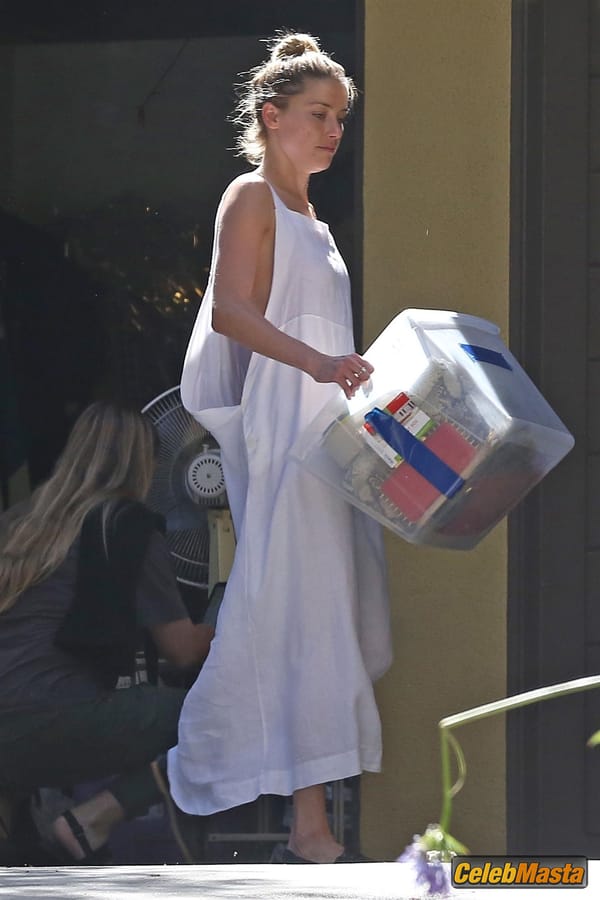 Amber Heard Nip Slip exposes Boob while cleaning out her garage in LA photo 10