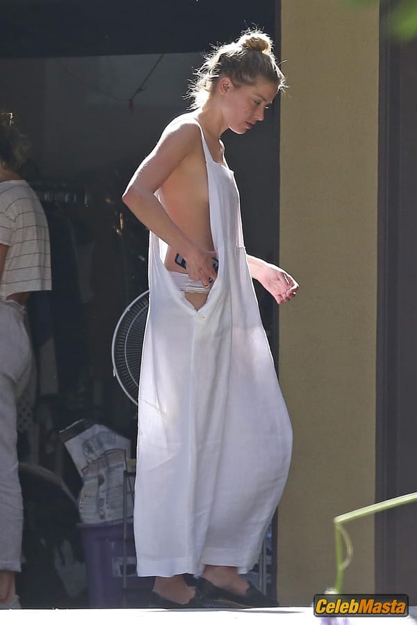 Amber Heard Nip Slip exposes Boob while cleaning out her garage in LA photo 13