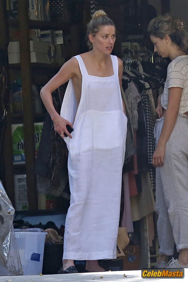 Amber Heard Nip Slip exposes Boob while cleaning out her garage in LA photo 14