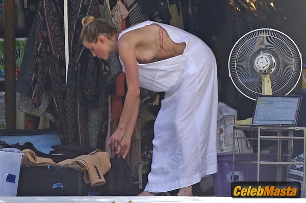 Amber Heard Nip Slip exposes Boob while cleaning out her garage in LA photo 15
