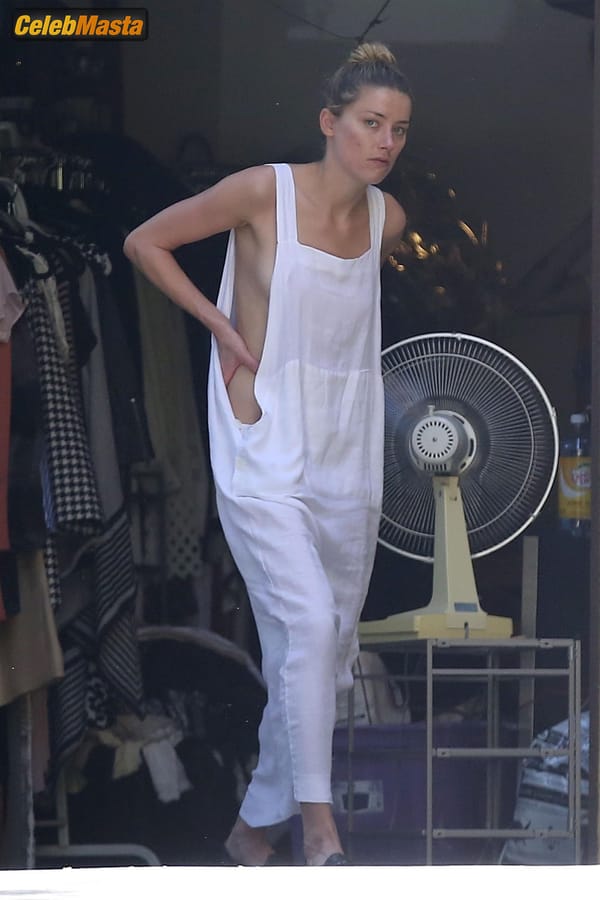 Amber Heard Nip Slip exposes Boob while cleaning out her garage in LA photo 17