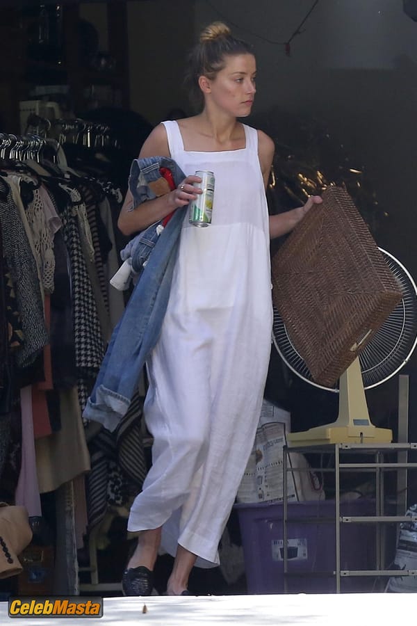 Amber Heard Nip Slip exposes Boob while cleaning out her garage in LA photo 18