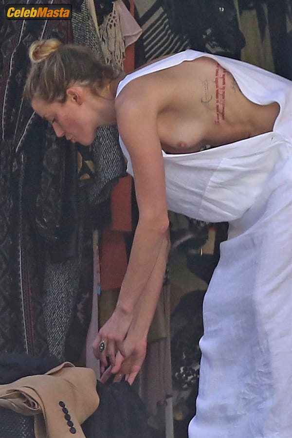 Amber Heard Nip Slip exposes Boob while cleaning out her garage in LA photo 26