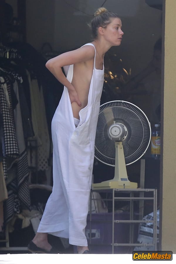 Amber Heard Nip Slip exposes Boob while cleaning out her garage in LA photo 31