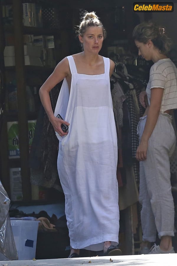 Amber Heard Nip Slip exposes Boob while cleaning out her garage in LA photo 32