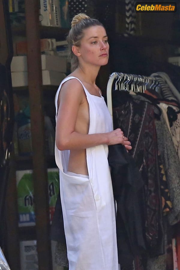Amber Heard Nip Slip exposes Boob while cleaning out her garage in LA photo 33