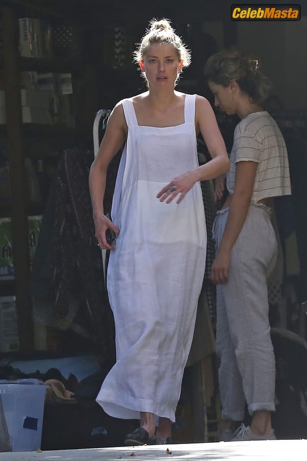 Amber Heard Nip Slip exposes Boob while cleaning out her garage in LA photo 36