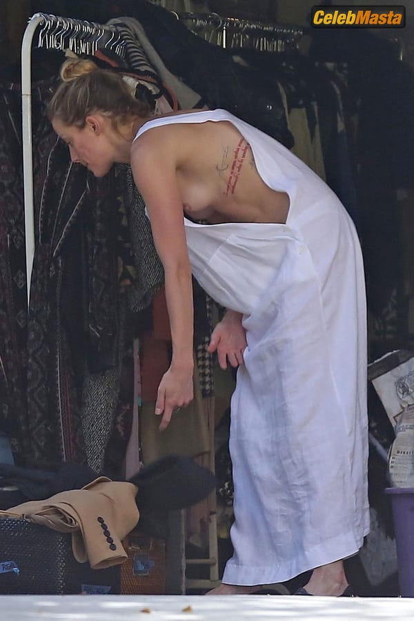 Amber Heard Nip Slip exposes Boob while cleaning out her garage in LA photo 40