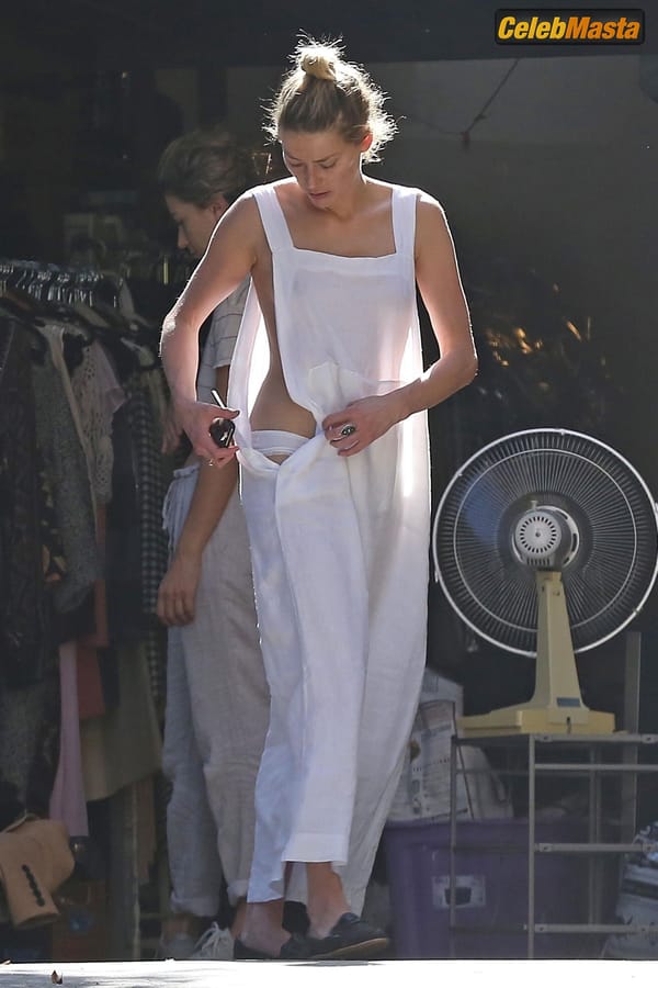 Amber Heard Nip Slip exposes Boob while cleaning out her garage in LA photo 42