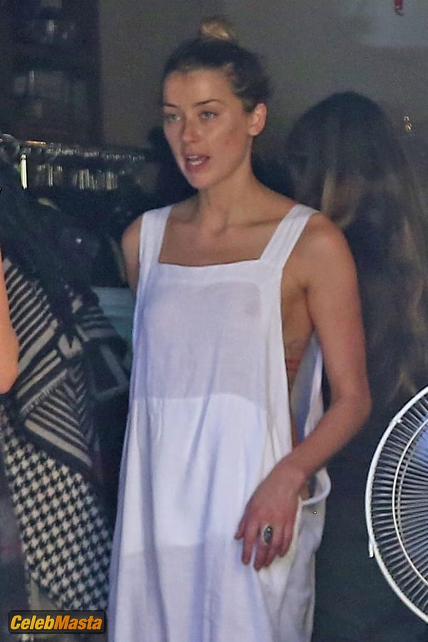 Amber Heard Nip Slip exposes Boob while cleaning out her garage in LA photo 43