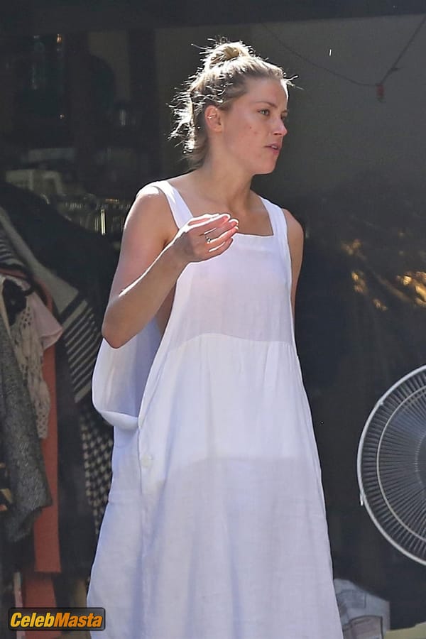 Amber Heard Nip Slip exposes Boob while cleaning out her garage in LA photo 50