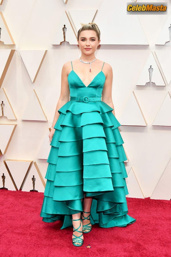 Florence Pugh poses on the red carpet wearing a turquoise dress during the Oscars arrivals at the 92nd Academy Awards in Hollywood photo 7