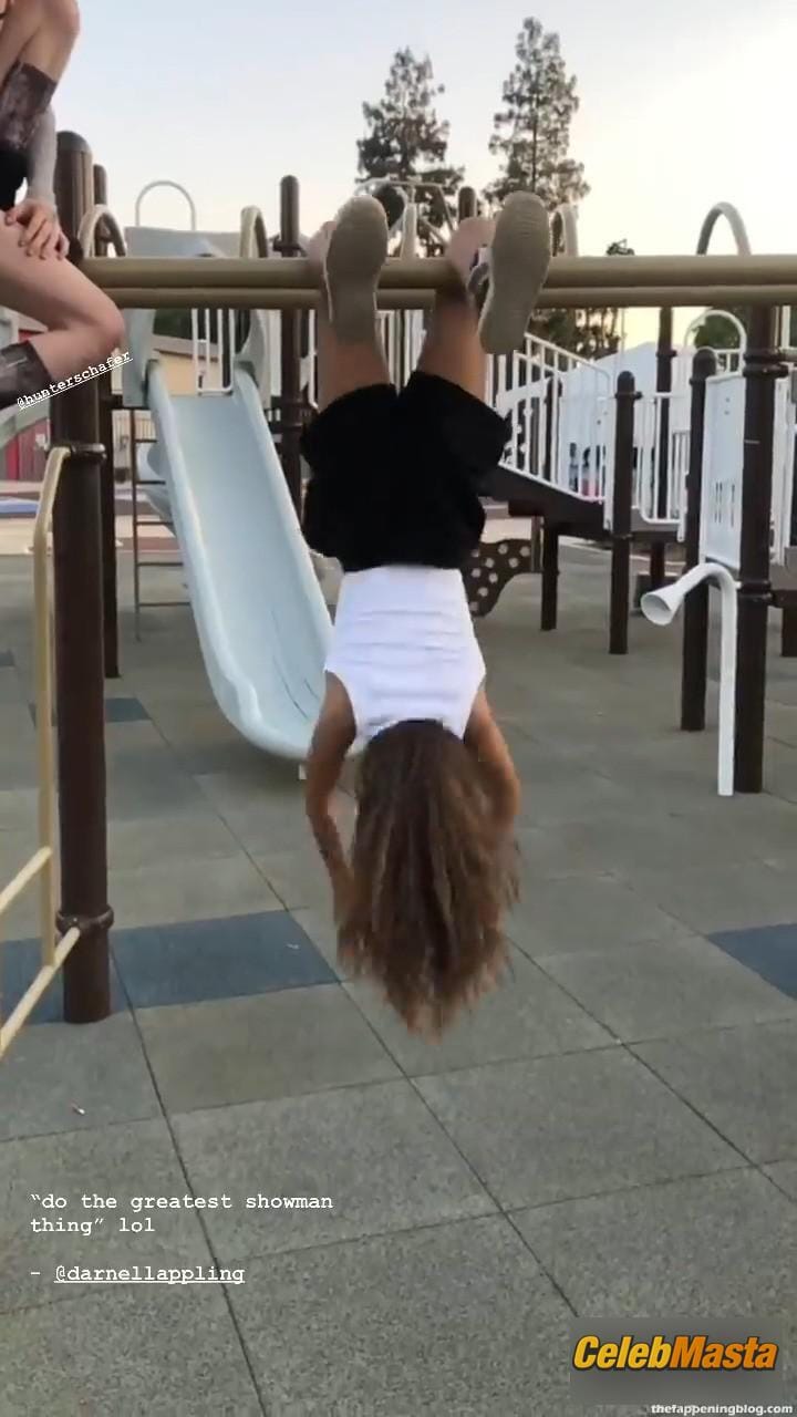 Zendaya poses on the playground in a white top without a bra and does a strange exercise Photo Gallery photo 4