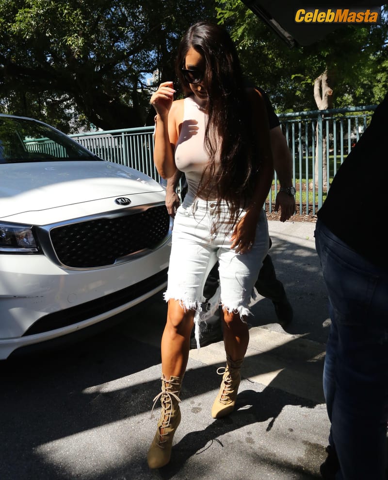 Kim Kardashian Goes Braless in Miami Wearing A Top Photo Gallery photo 2
