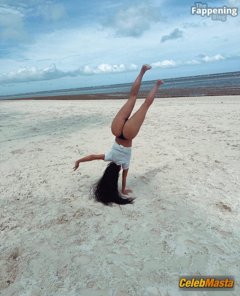 Kim Kardashian Sizzles In Sexy Beach Cartwheels Photo Gallery photo 1