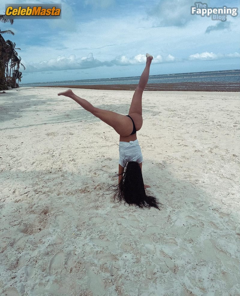Kim Kardashian Sizzles In Sexy Beach Cartwheels Photo Gallery photo 2