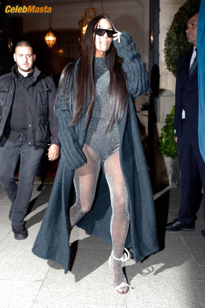 Kim Kardashian leaves her hotel in Paris in black sunglasses and long black patterned coat Photo Gallery photo 3