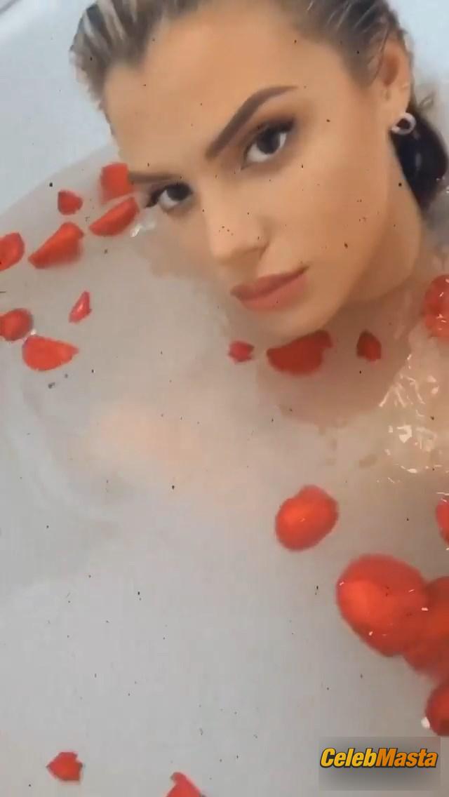 Alissa Violet in the bath with rose petals covering her breasts with her hands Photo Gallery photo 3