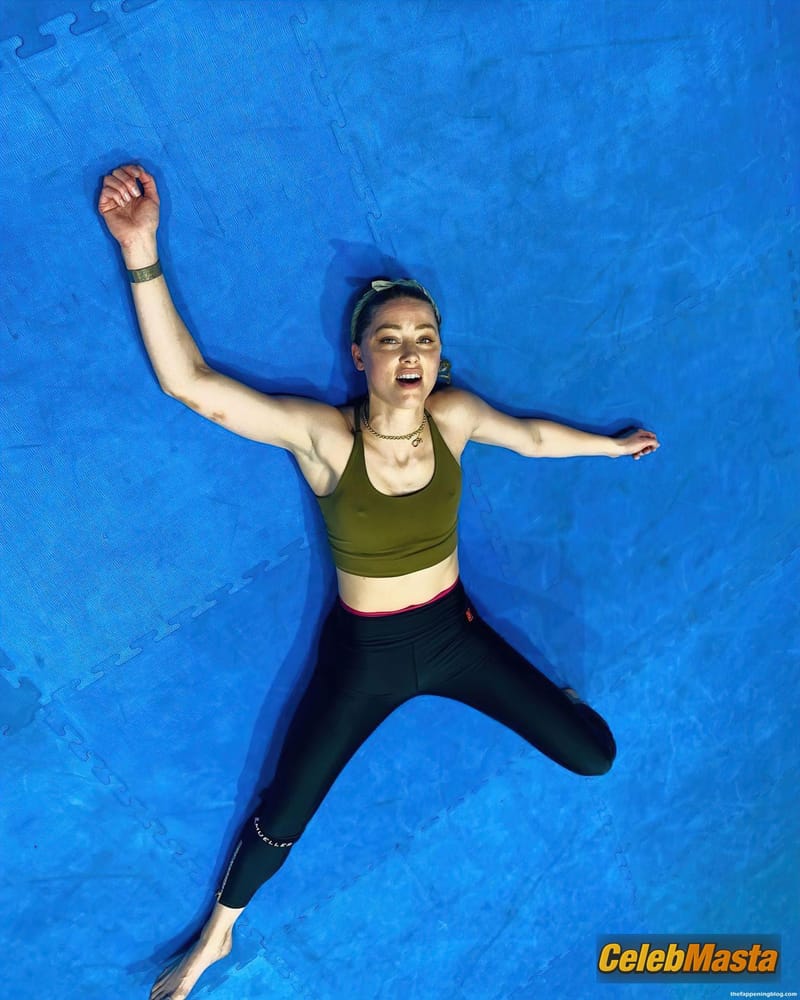 Amber Heard Sexy Shows Off Her Pokies While Working Out Photo Gallery photo 1