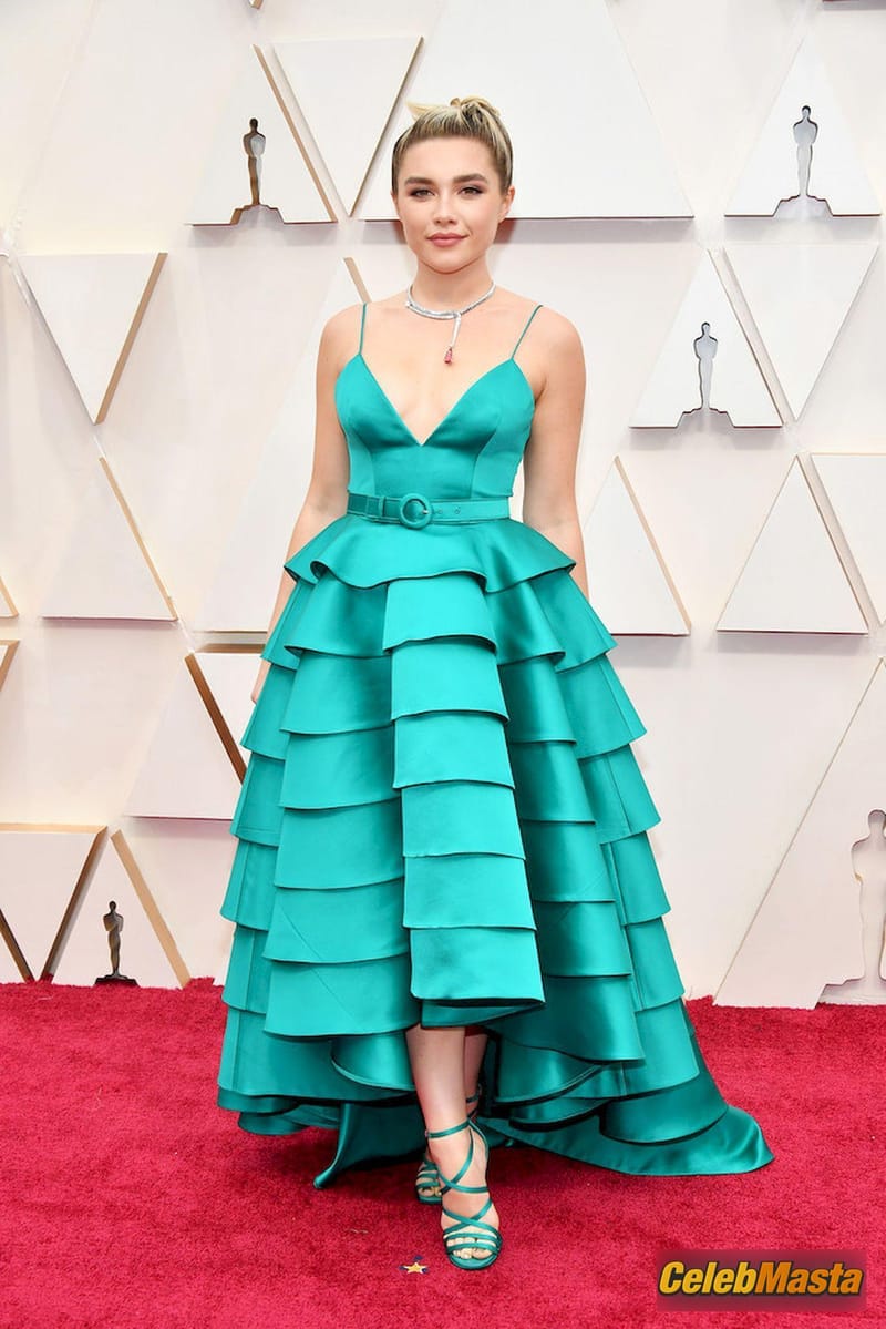 Florence Pugh poses on the red carpet wearing a turquoise dress during the Oscars arrivals at the 92nd Academy Awards in Hollywood Photo Gallery photo 1