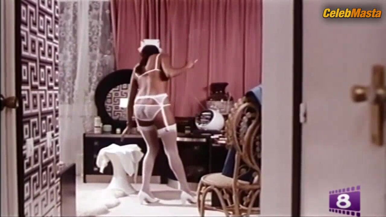 Laura Gemser Flaunts Lesbian Butt Scene In Malizia Erotica - Photo 2 of 5