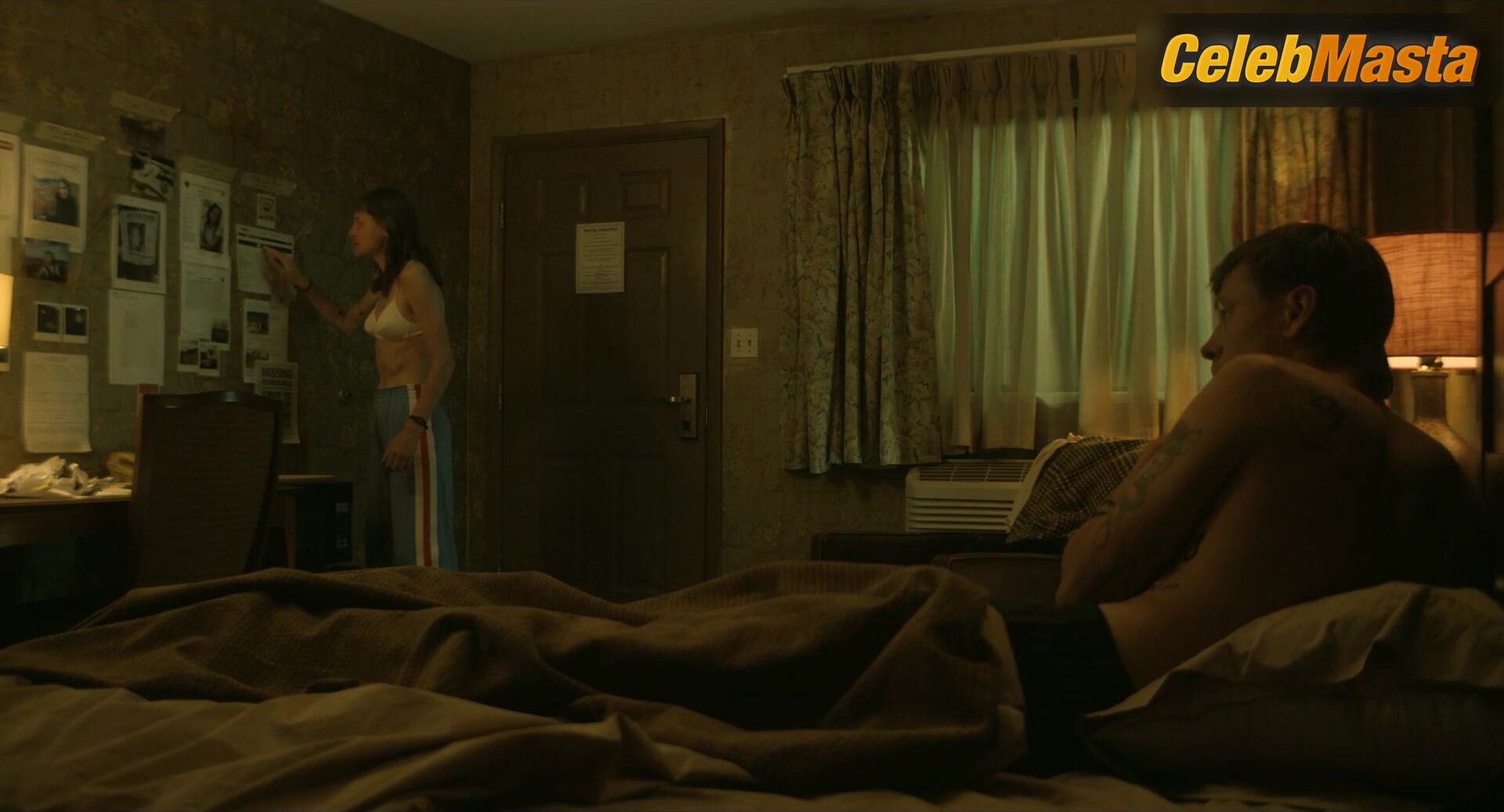 Emma Corrin Displays Underwear Scene In A Murder At The - Photo 1 of 5